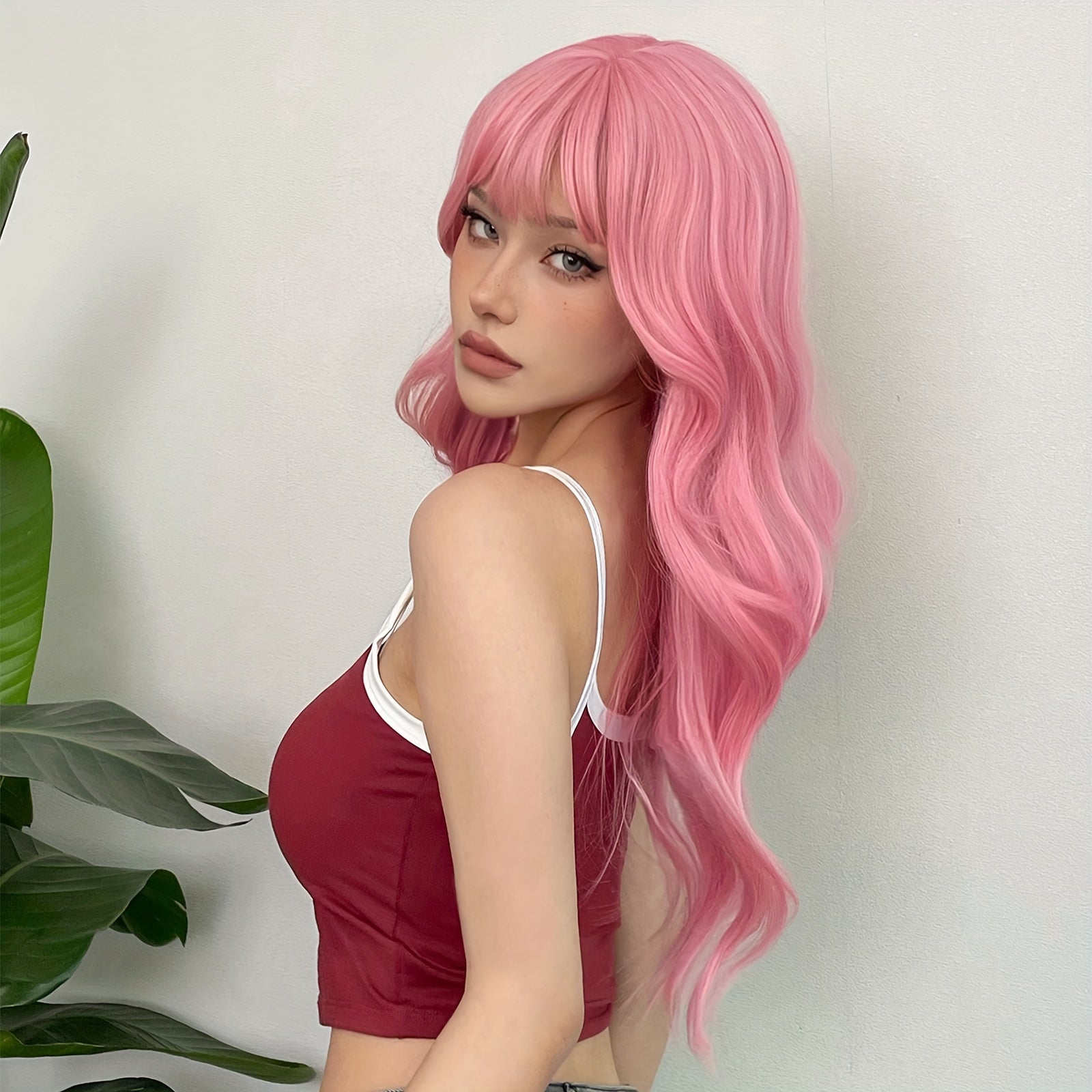 Pink long body wave wig with bangs perfect for stylish makeovers or costume events