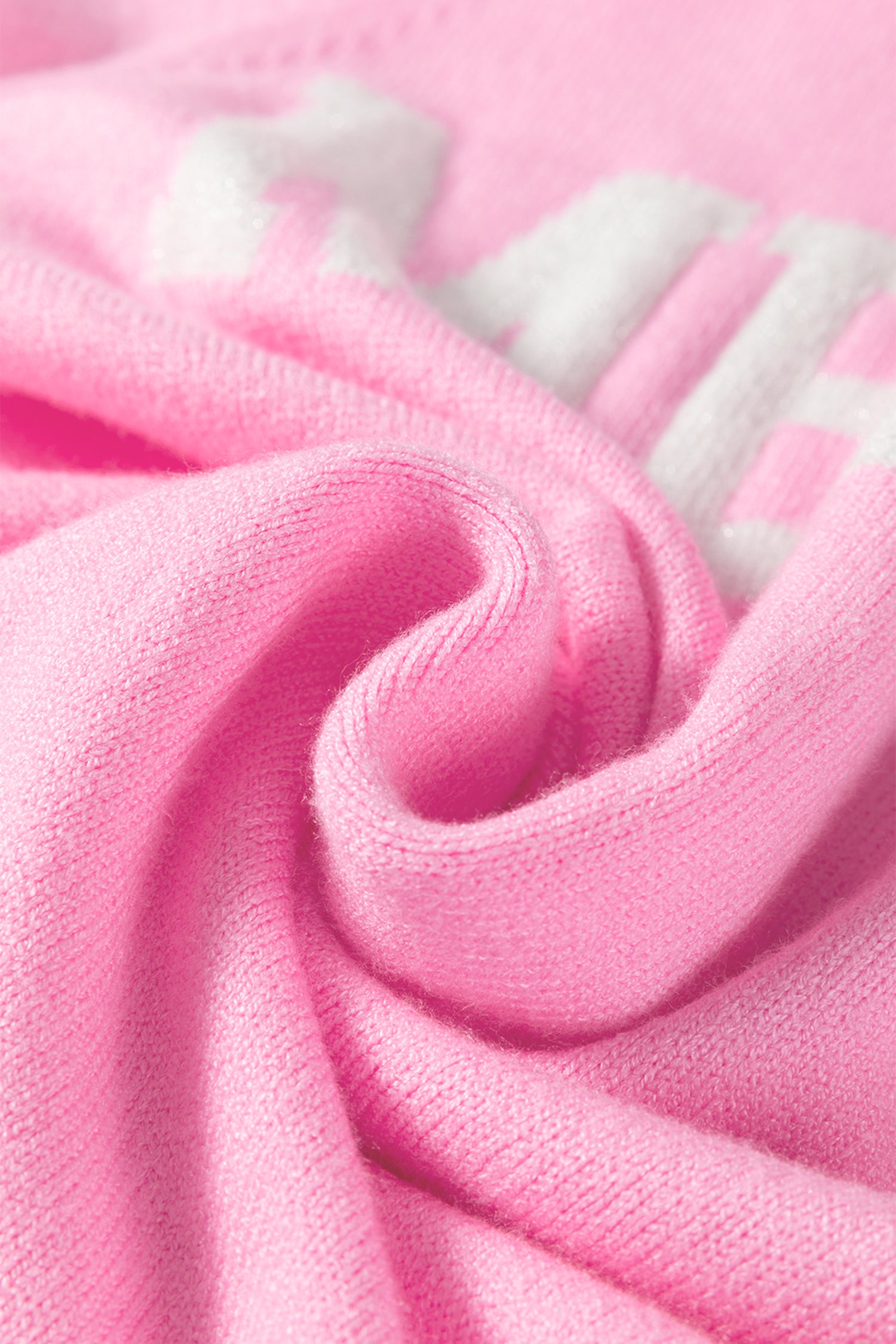 Pink LuckeLadybug white MERRY Christmas sweater fabric detail showing soft texture and cozy feel