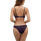 Back view of woman wearing pink neon heart bikini with adjustable straps and heart pattern