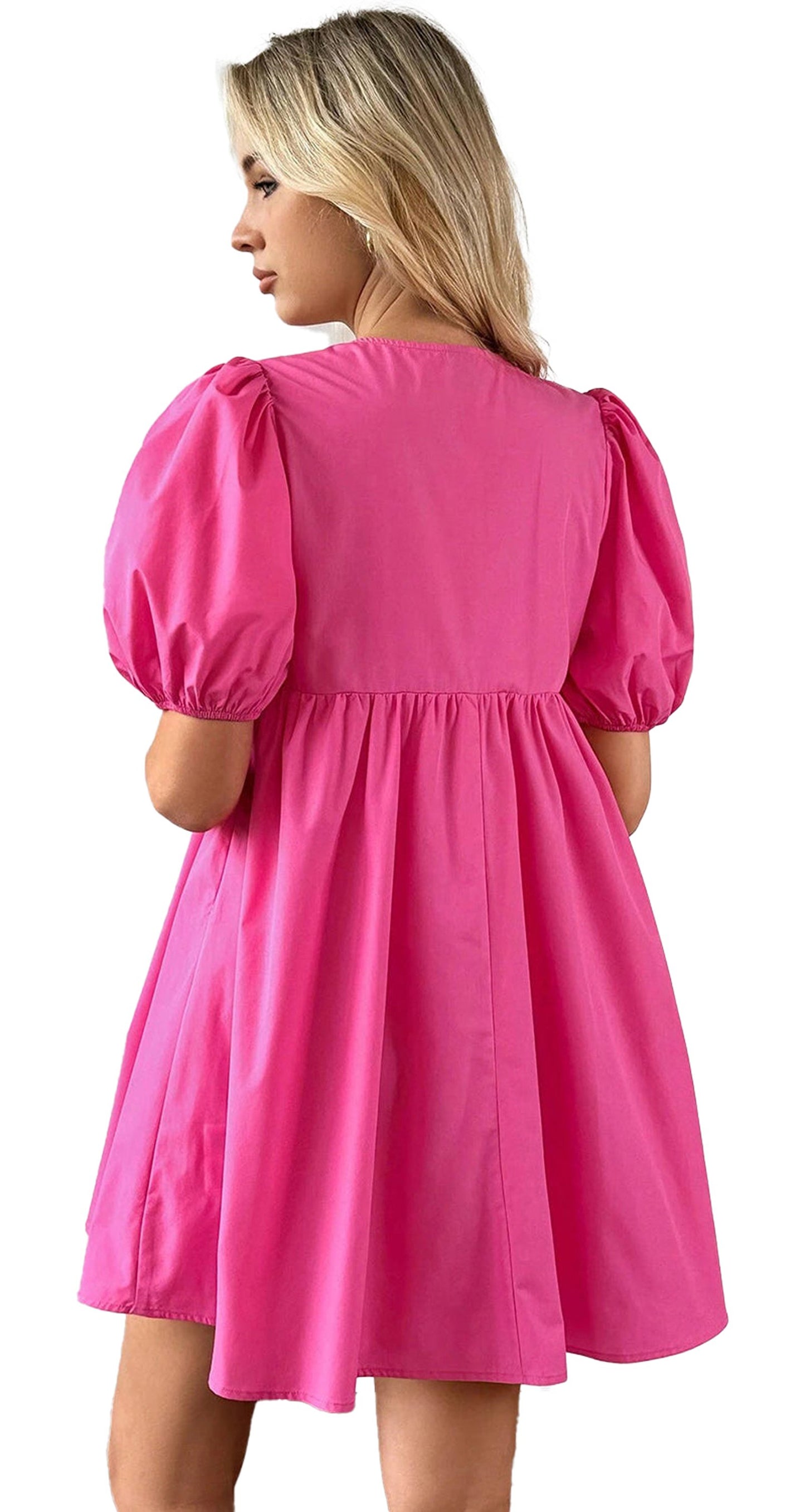 Back view of a pink puff sleeve mini dress by LuckeLadybug with a flowy silhouette