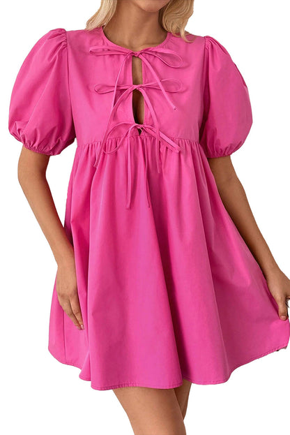 LuckeLadybug pink puff sleeve mini dress with a playful tie front design and flowing silhouette