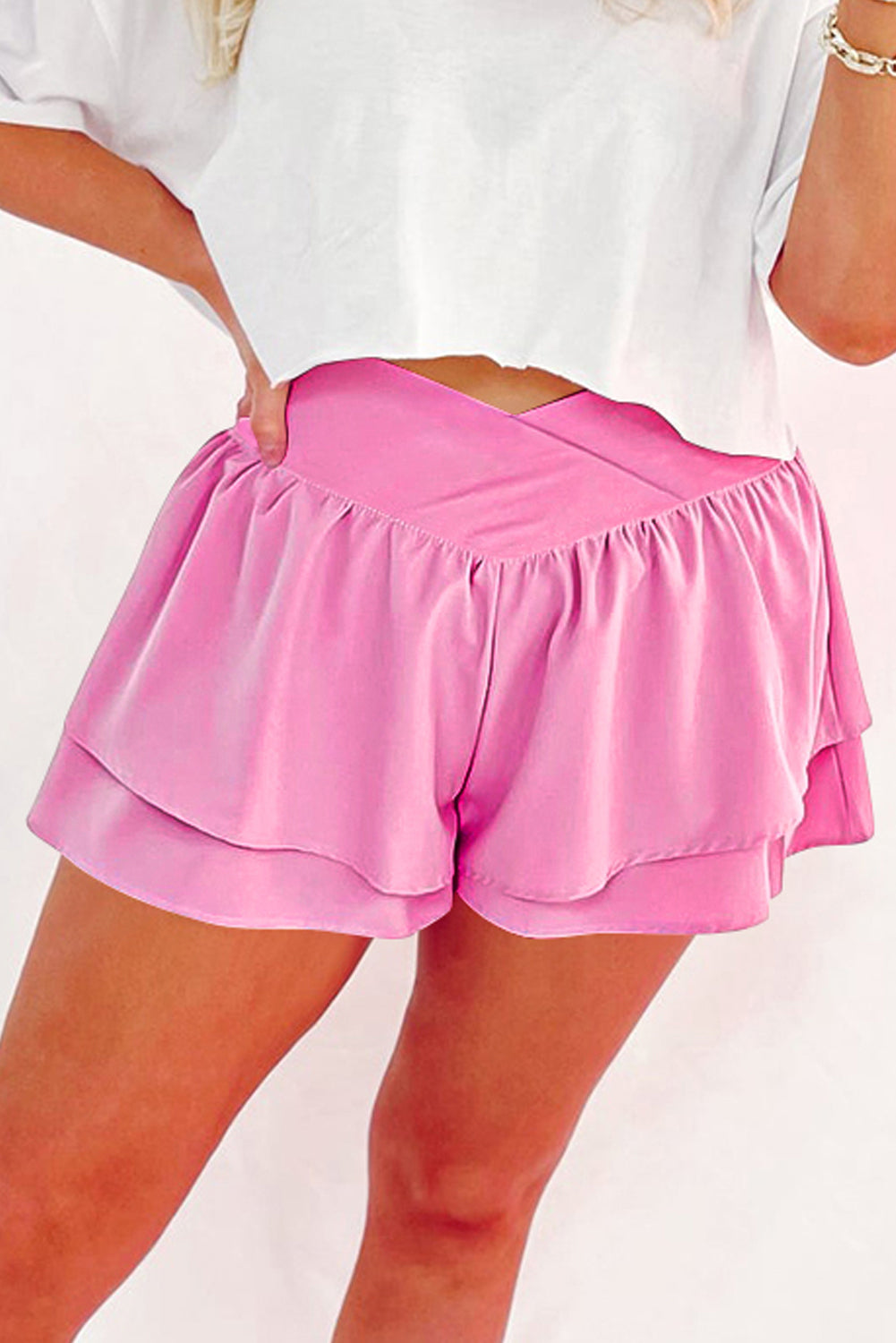 Trendy pink shorts dress with layered ruffle design for a stylish summer look