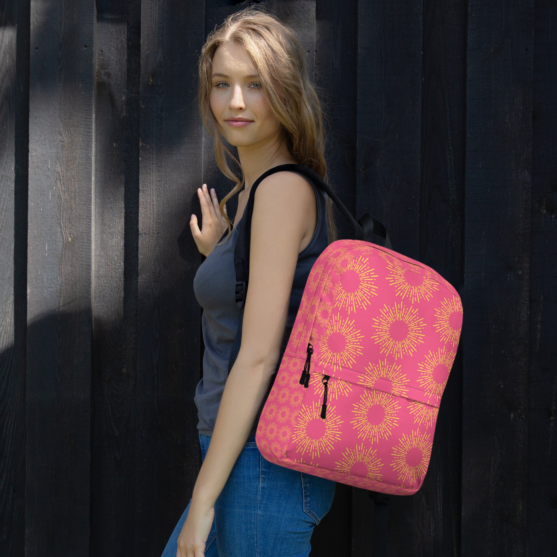Pink stylish backpack with sunflower design, perfect for school or casual outings