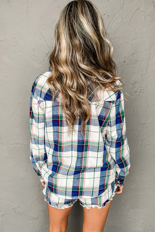 Woman wearing a plaid shirt with stylish ruffled shorts, showing a relaxed back view.