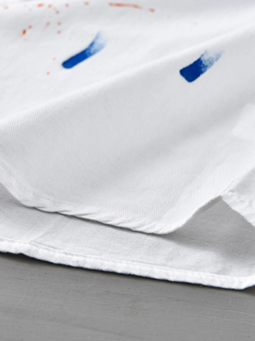 Close-up of a soft white button-up shirt, ideal for plus size clothing for women's fashion.
