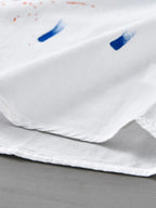 Close-up of a soft white button-up shirt, ideal for plus size clothing for women's fashion.