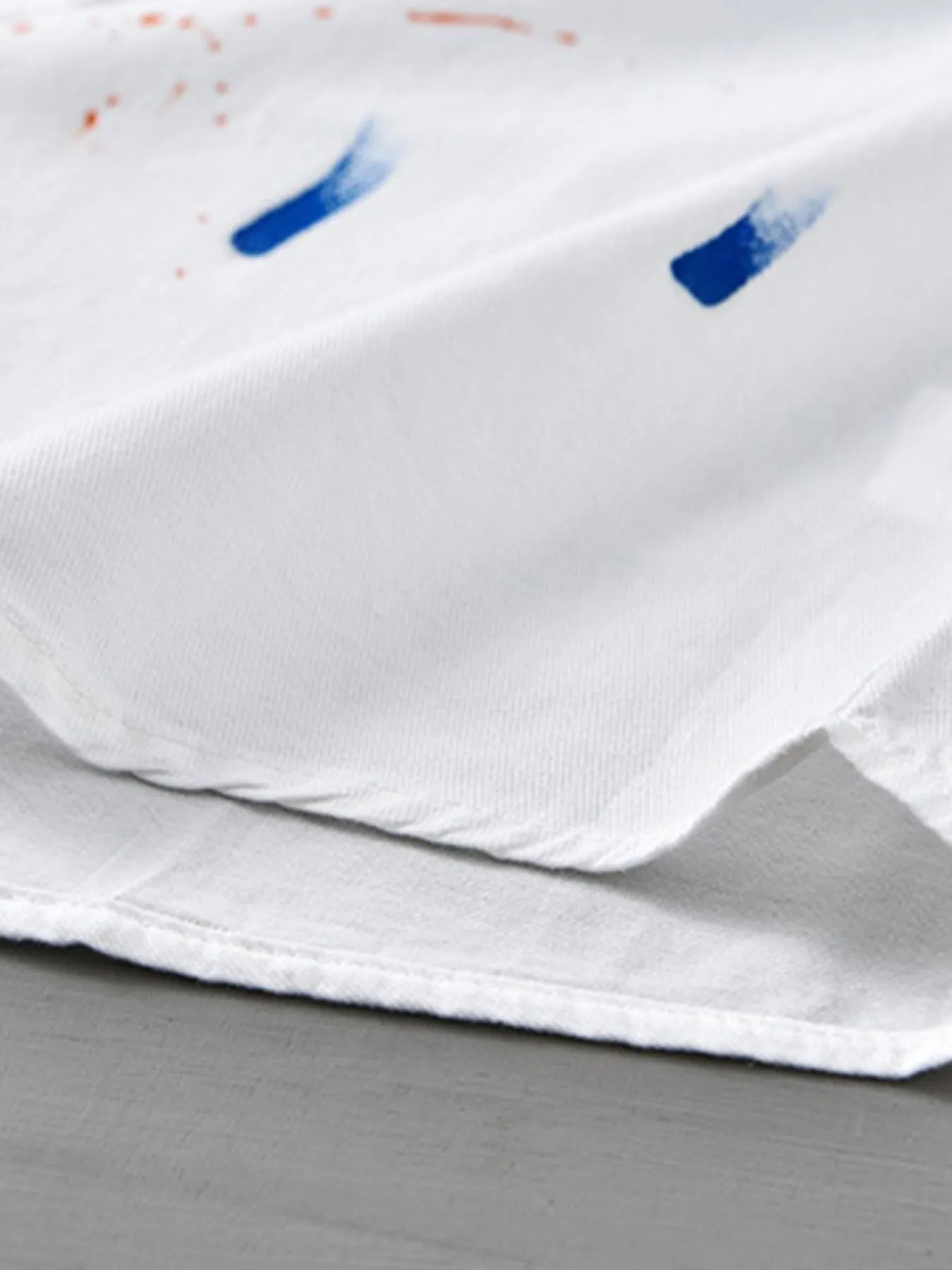 Close-up of a soft white button-up shirt, ideal for plus size clothing for women's fashion.