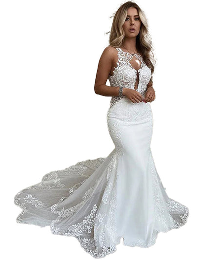 Elegant plus size mermaid wedding dress with lace details and a stunning train for a romantic bridal look
