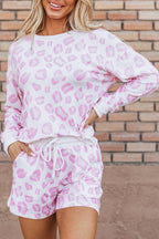 Pink and white shorts featuring a stylish print leopard design, perfect for casual wear