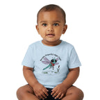 A baby sitting cross-legged wearing a light blue t-shirt with a cartoon dragonfly graphic and the text 'Barney Dragonfly's Night Flight' on a plain white background.