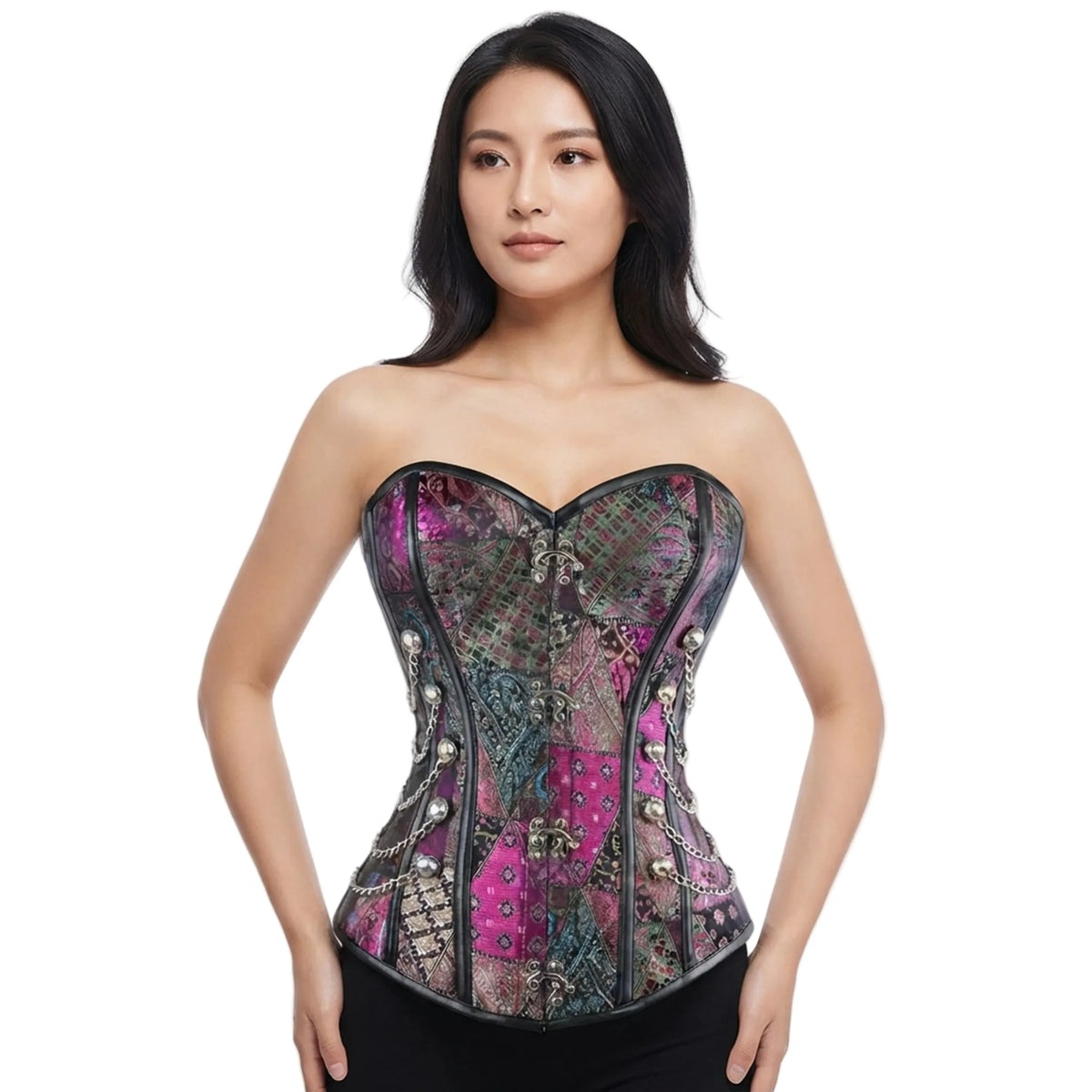 A woman modeling a strapless corset top with a heart-shaped bust, featuring a multicolor paisley and geometric print in pink, purple, green, and black with metallic silver embellishments, set against a plain white background.