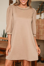 Beige puff sleeve dress from LuckeLadybug LLC with elegant shirred detailing for a stylish look