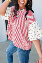 LuckeLadybug LLC puff sleeve dress featuring striped pattern with floral accents on sleeves