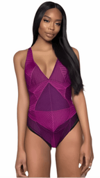 Purple abstract one-piece swimsuit with geometric pattern worn by woman with long black hair