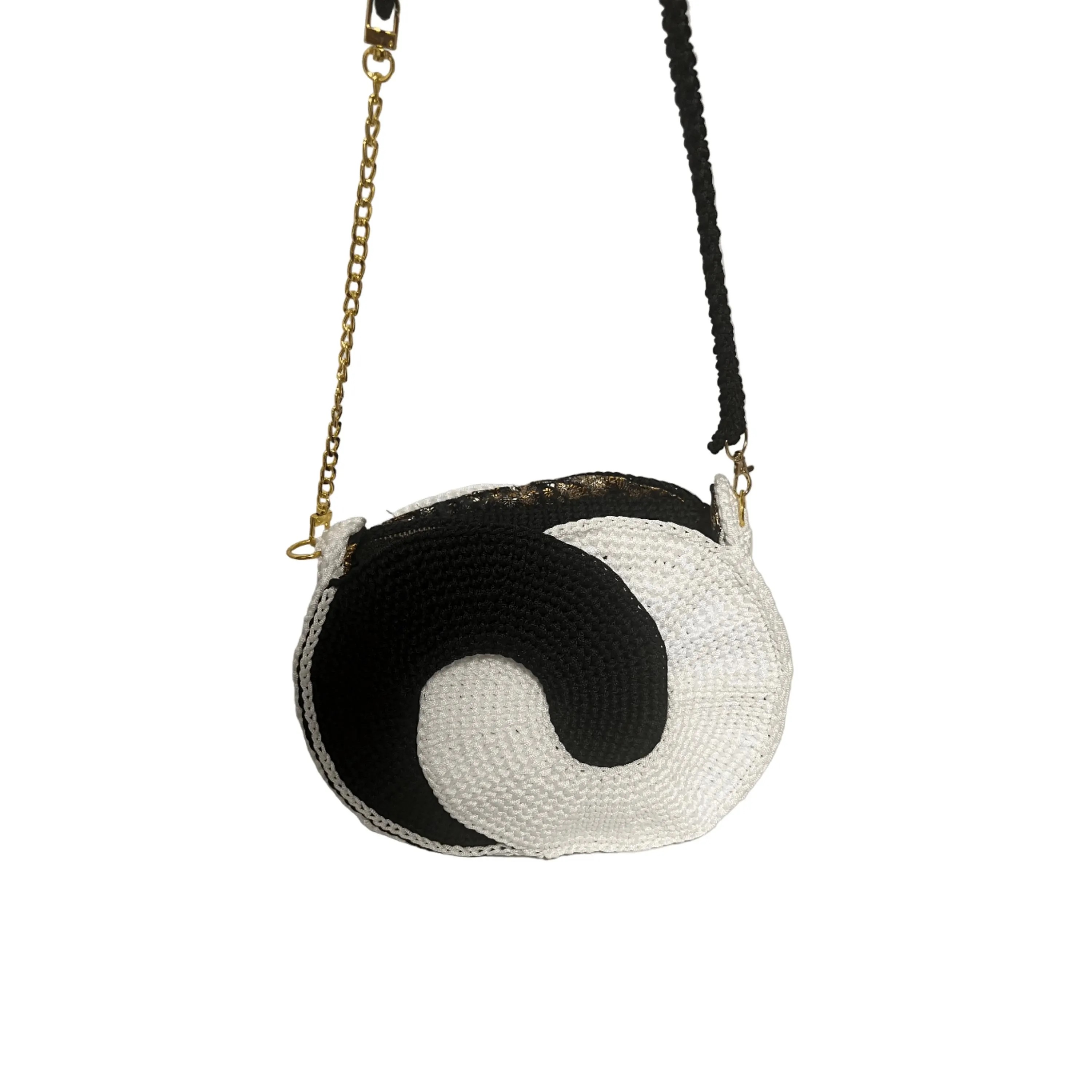 Stylish purse crochet crossbody bag with a black and white swirl design and adjustable chain strap