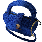Blue crochet purse with a top handle and gold chain detail for stylish outings