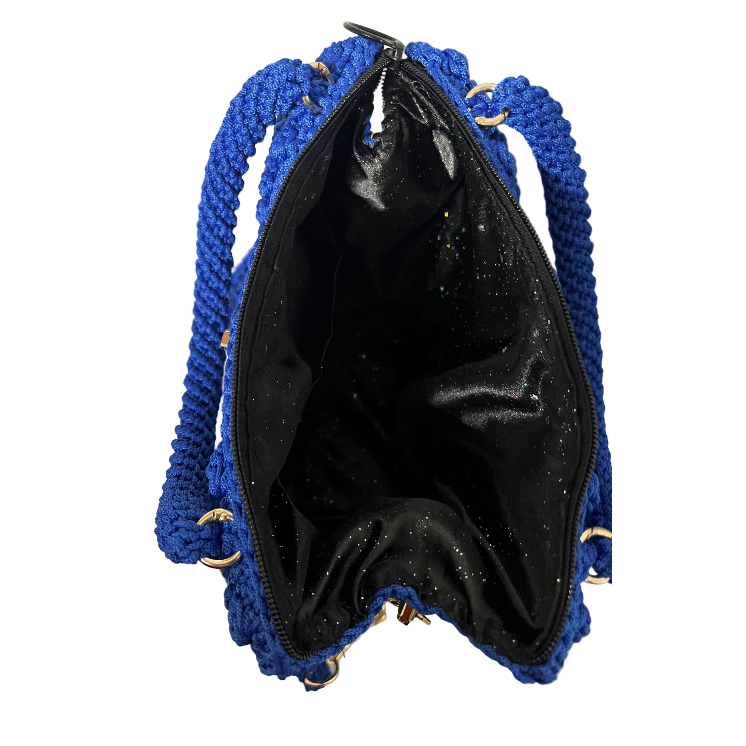 Inside view of a blue shoulder purse crochet with a spacious black lining for storage
