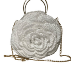 Elegant white purse crochet with a floral design and a gold chain strap for stylish outings