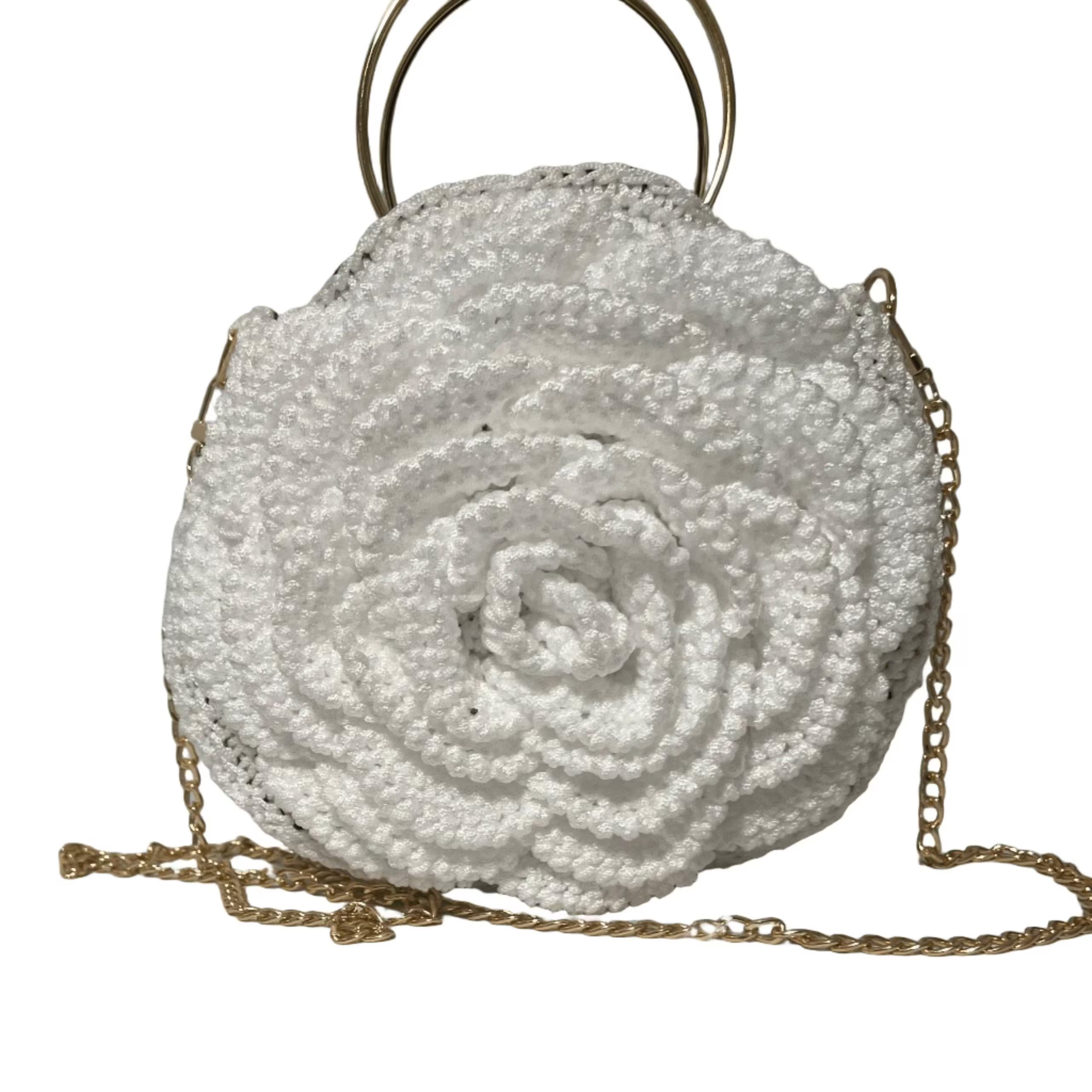 Elegant white purse crochet with a floral design and a gold chain strap for stylish outings