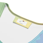 Close-up of the neckline of a LuckeLadybug rainbow bodycon dress featuring a soft fabric design