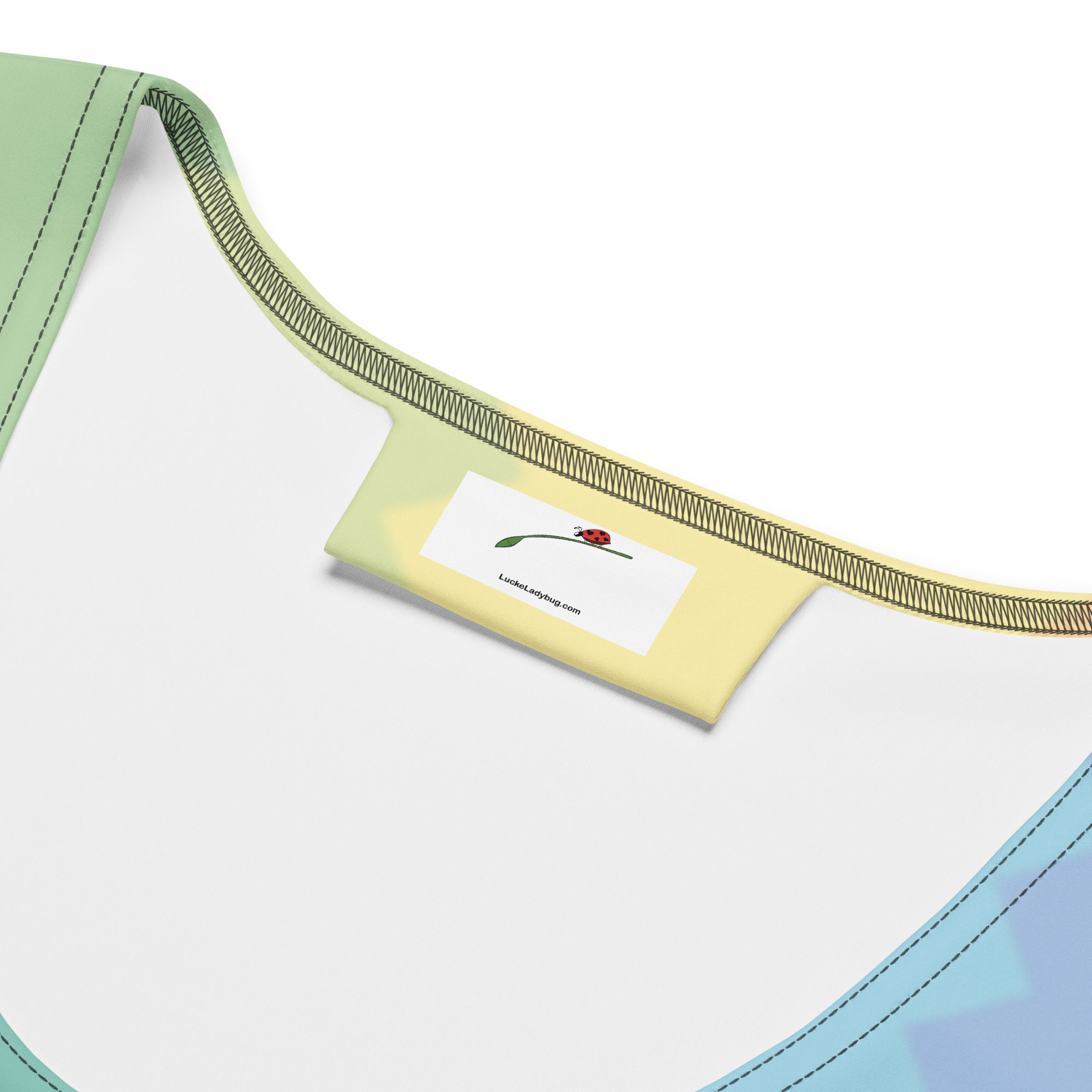 Close-up of the neckline of a LuckeLadybug rainbow bodycon dress featuring a soft fabric design