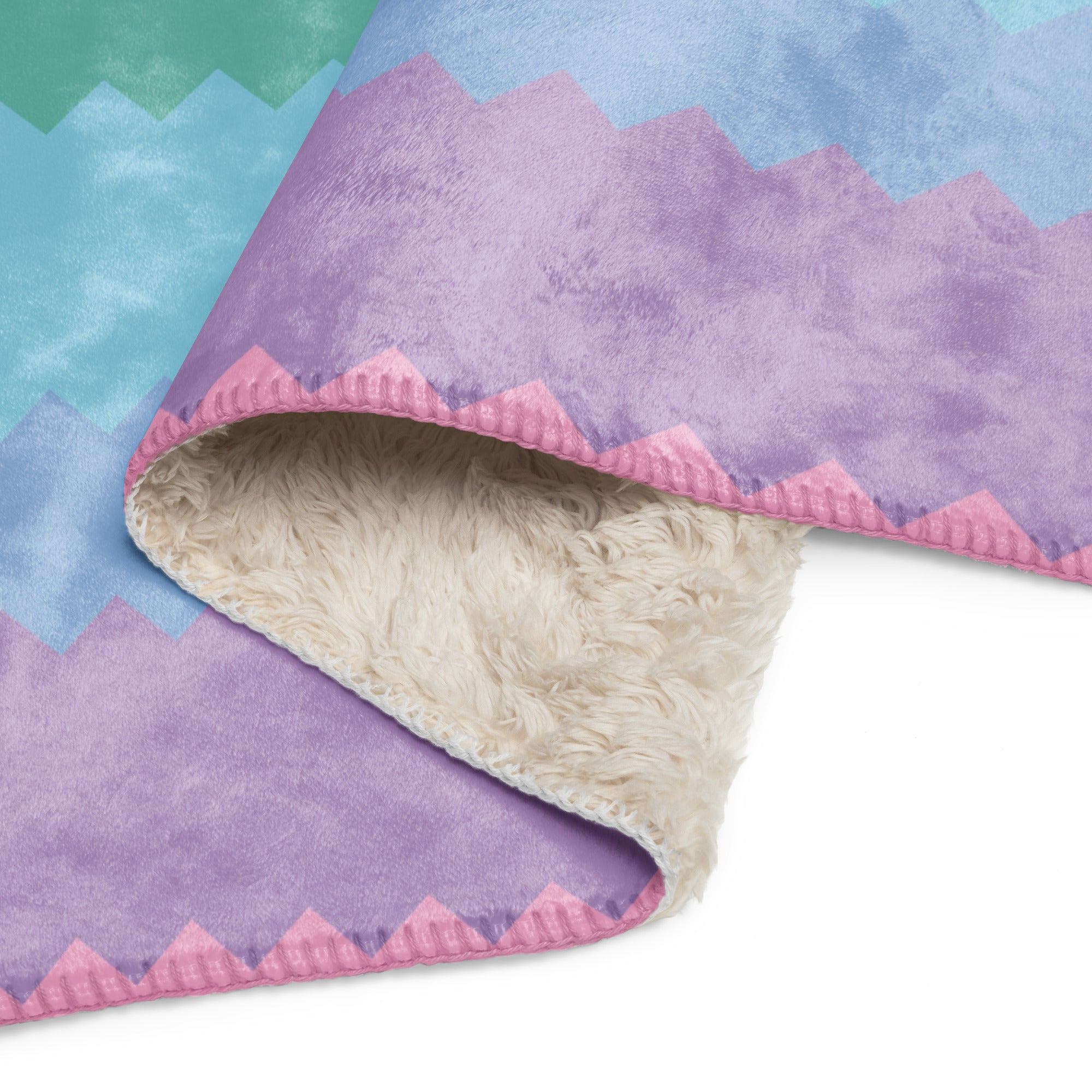 LuckeLadybug rainbow pride sherpa blanket with colorful zigzag pattern and soft cream sherpa lining