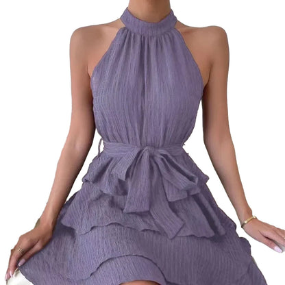 Elegant red halter mini dress for women featuring a flowing skirt and bow tie waist detail