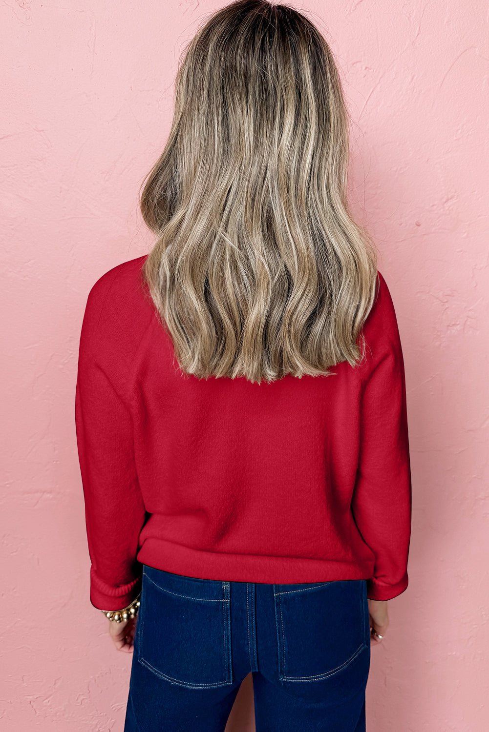 Red sweater with a casual fit, perfect for pairing with jeans, featuring a white MERRY Christmas sweater design.