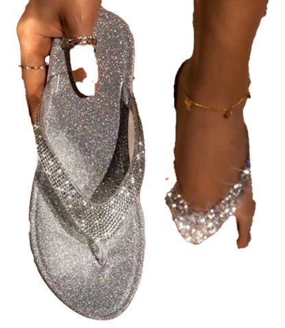 Sparkly rhinestone flip flop sandals for women with a shiny silver finish and comfortable design