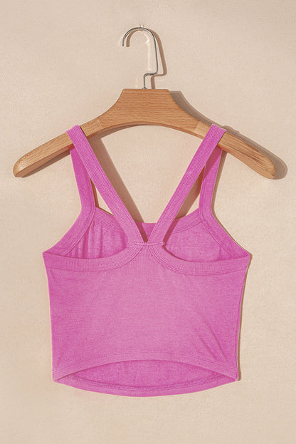 LuckeLadybug ribbed cropped cami top in bright pink with double shoulder straps hanging on wooden hanger
