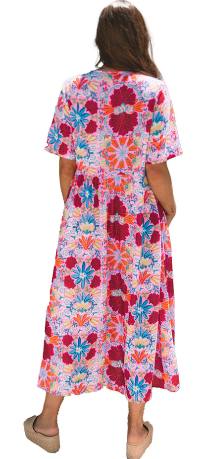 Back view of the rose floral tied front dress with vibrant colors and short sleeves, perfect for summer outings.