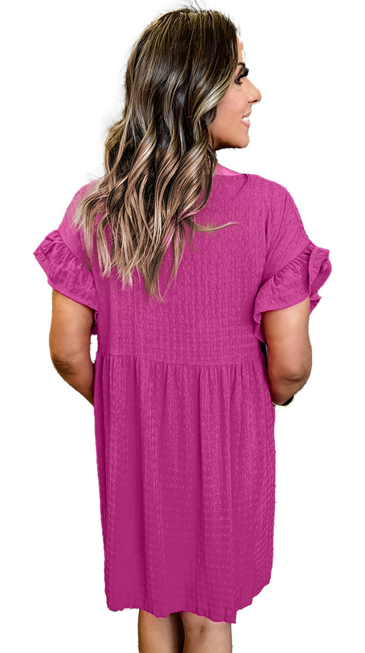 Back view of a rose red ruffled mini dress with short sleeves by LuckeLadybug