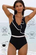 Black ruffled swimsuit by LuckeLadybug LLC with stylish design and tummy control features