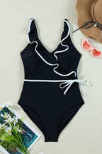 Black ruffled swimsuit by LuckeLadybug with a stylish wrap design and ruffled neckline