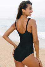 LuckeLadybug LLC Ruffled swimsuit in black, featuring adjustable straps and a stylish back design
