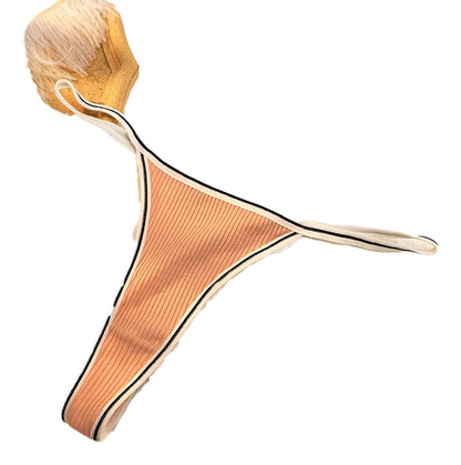 Comfortable seamless thong for women in a nude color with stylish trim for everyday wear