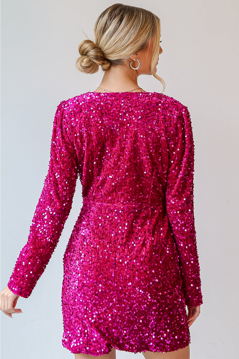 Back view of a pink sequin dress by LuckeLadybug LLC, perfect for evening parties with dazzling shine.