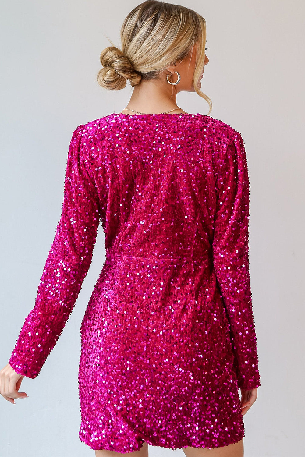 Back view of a pink dress covered in vibrant sequins, ideal for sequin for dress enthusiasts