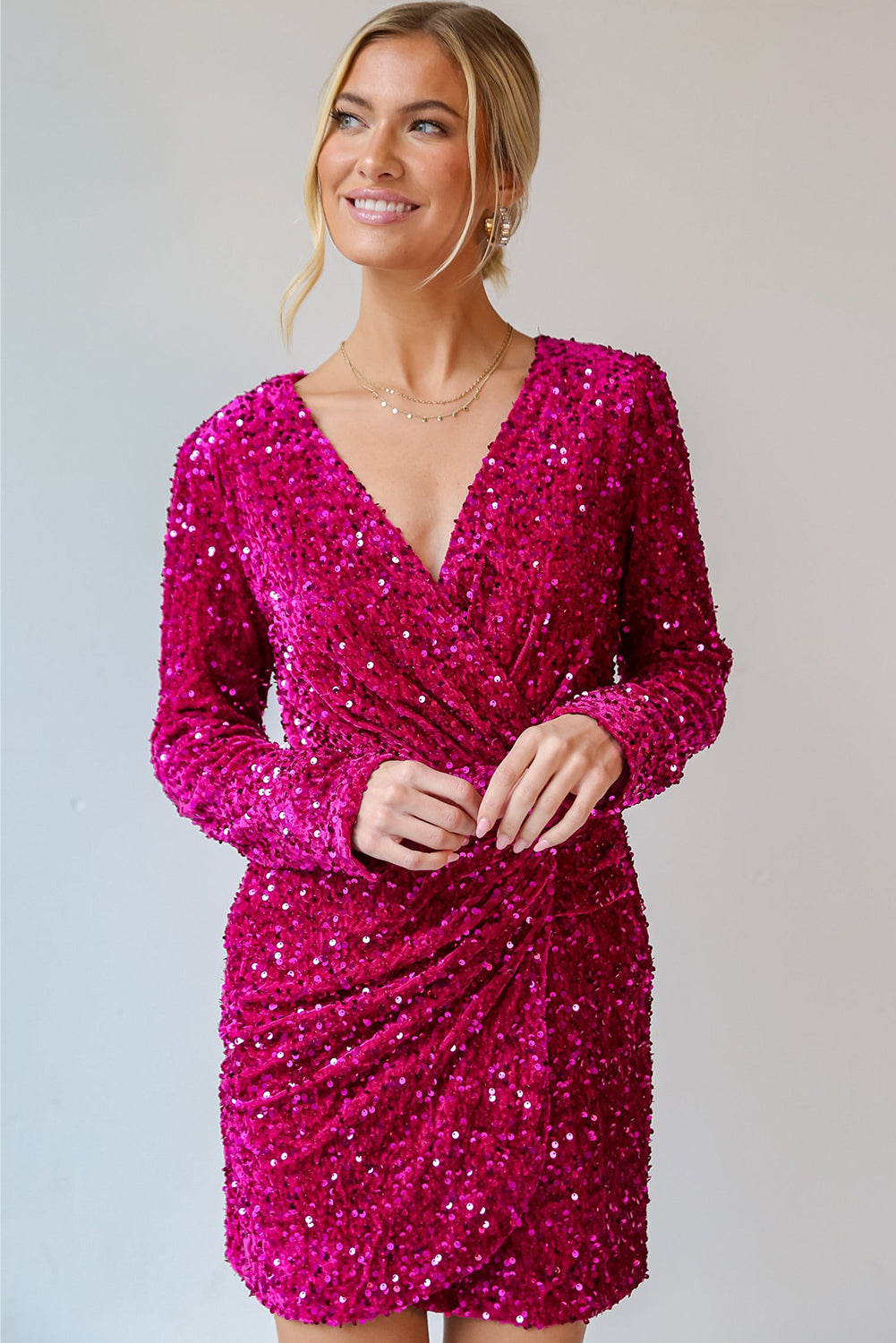 Luxurious pink sequin for dress with long sleeves and a flattering wrap design