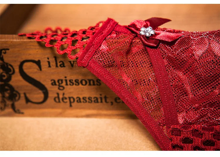Red sexy crotchless thongs for women with lace detailing and decorative bow