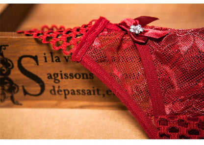Red sexy crotchless thongs for women with lace detailing and decorative bow