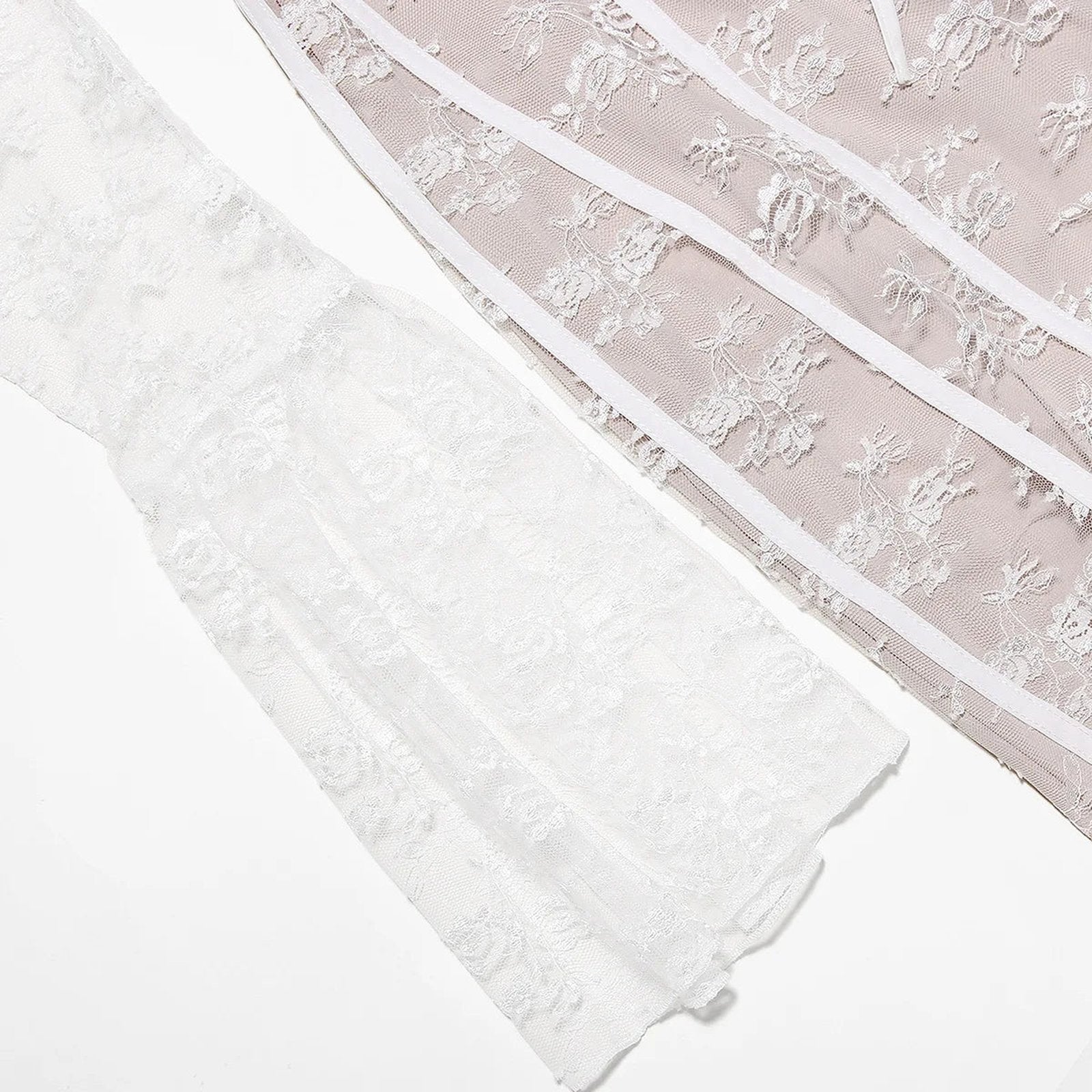 Close-up of a sexy lace long sleeve dress featuring intricate floral details and flowing design