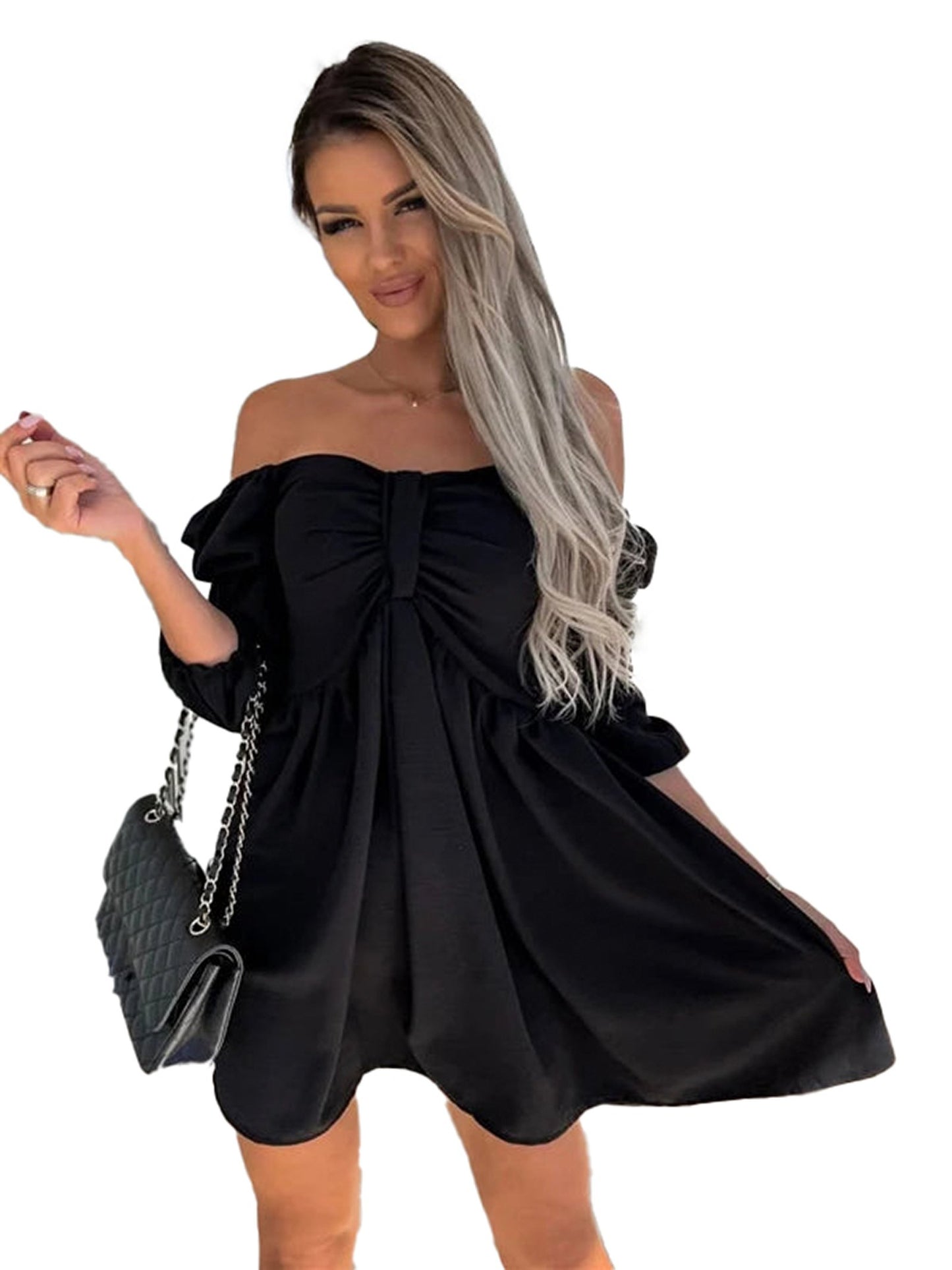 Model wearing a sexy off shoulder mini dress in black, with a fitted bodice and flowing skirt