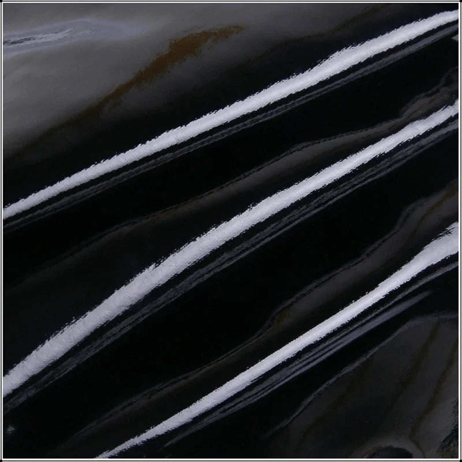 Close-up of a sexy patent leather mermaid dress with glossy finish and sleek lines