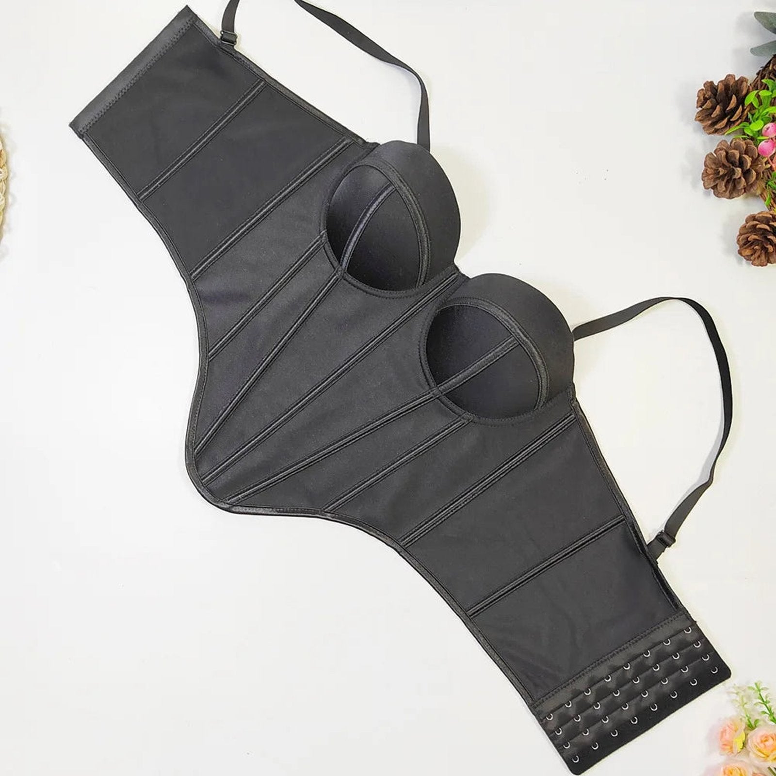 Sleek black design of a sexy red corset top for women featuring adjustable straps and bust support