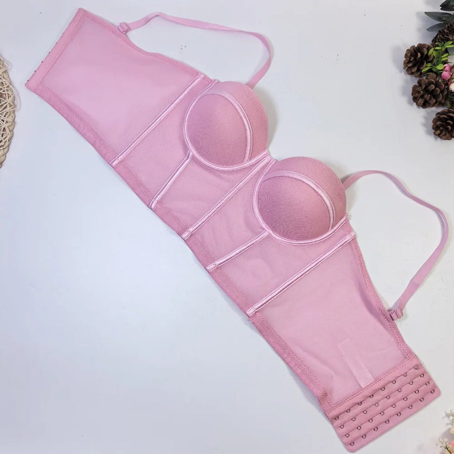 Pink lace detailing and structured design of a sexy red corset top for women