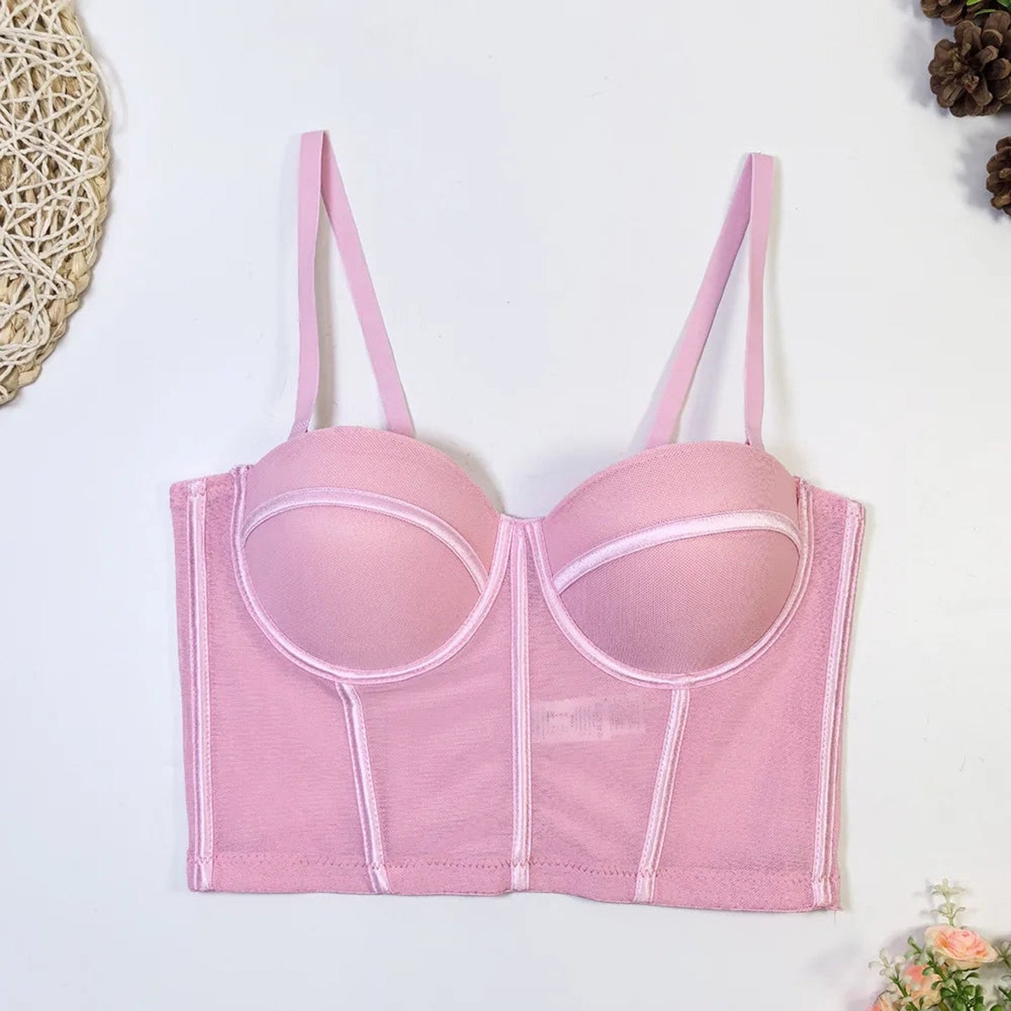 Pink corset top for women featuring adjustable straps, perfect for pairing with outfits or lingerie. Sexy red corset top for women.