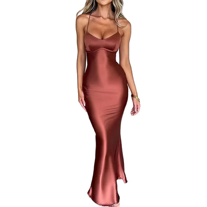 Model wearing a sexy satin evening gown in rust color, showcasing a sleek and elegant silhouette