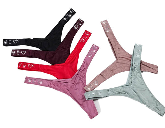 Colorful assortment of sexy thongs for women in various shades and designs by LuckeLadybug LLC