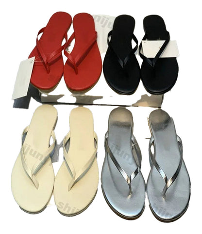 Colorful assortment of women's comfortable flip flops in red, black, silver, and beige by LuckeLadybug LLC